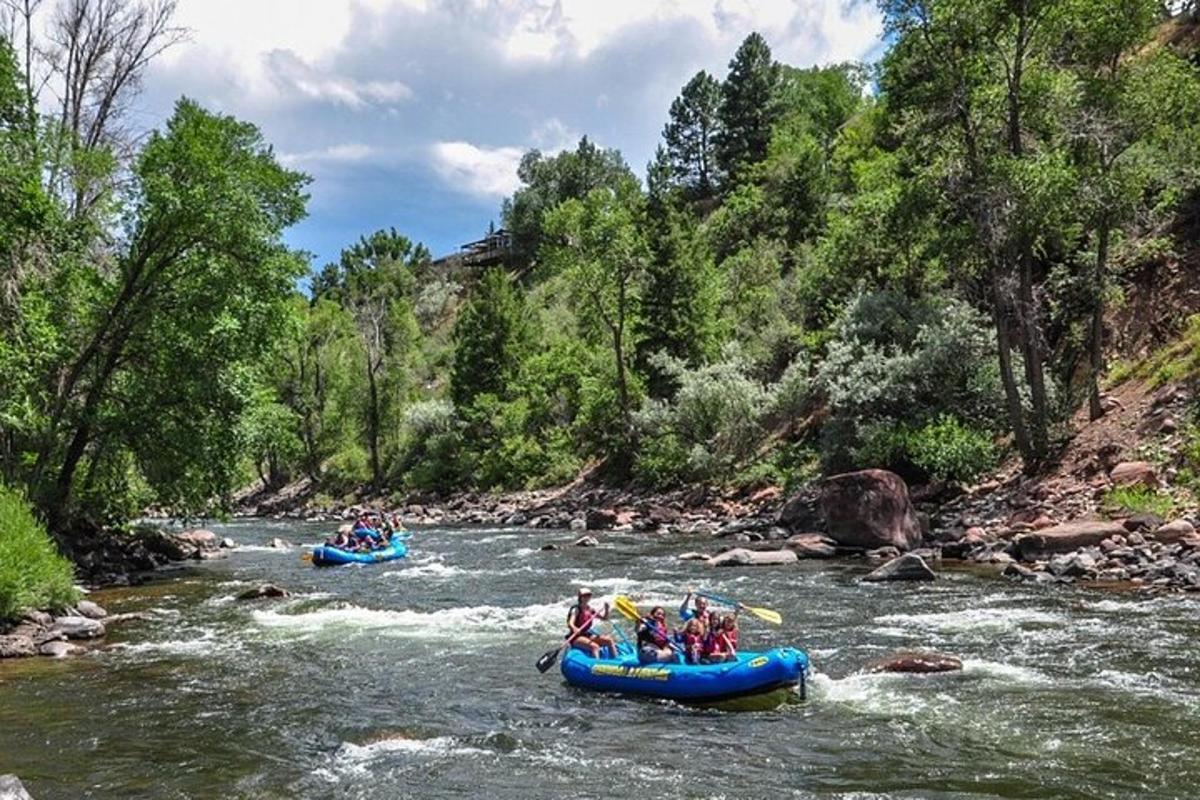 a group of people are rafting down a river