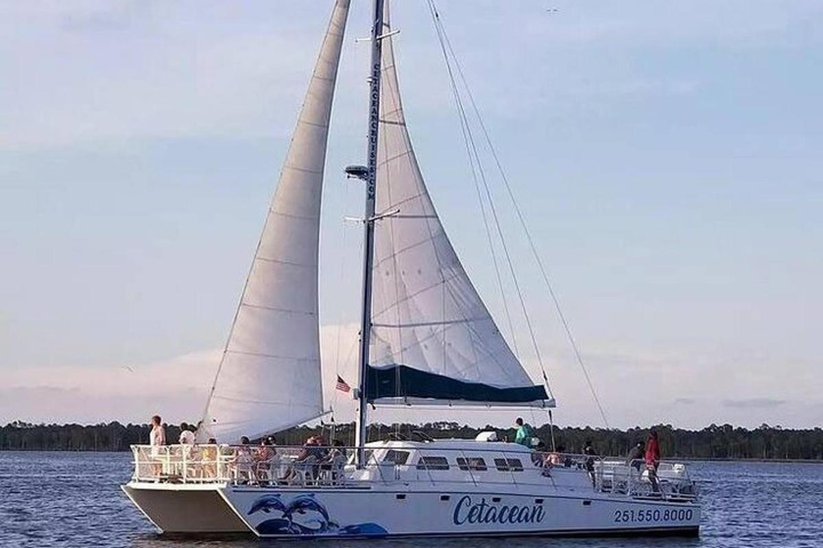 a boat with people on it in the water