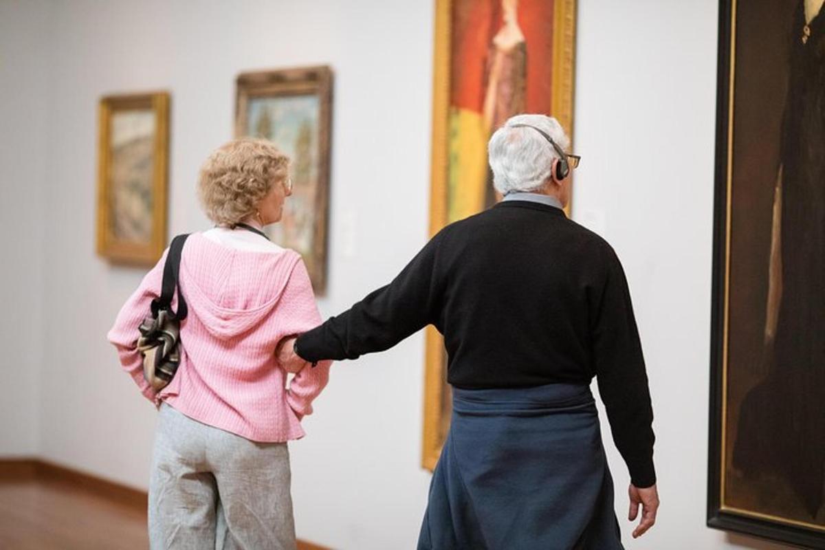 a man and a woman looking at art