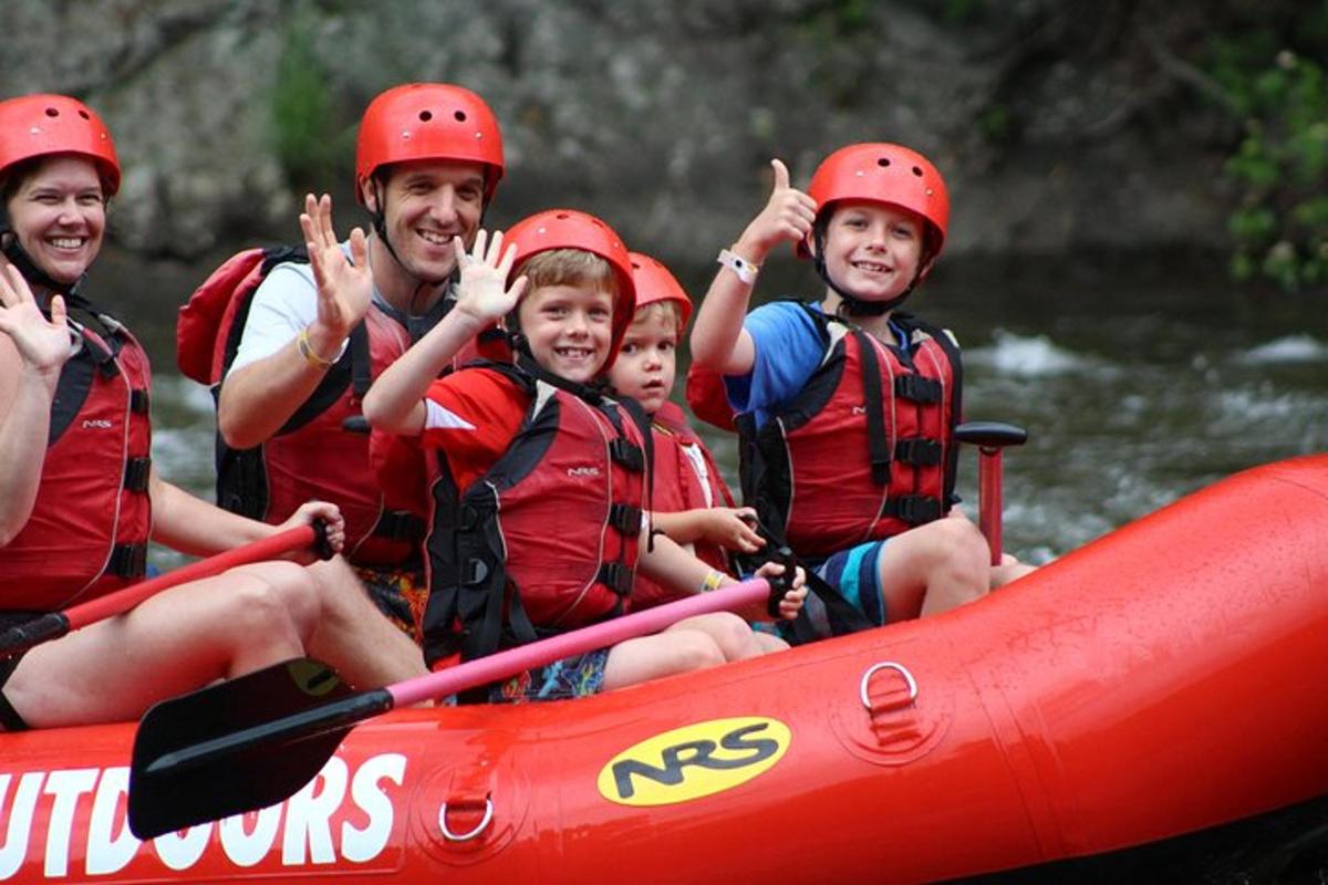 a group of people in a raft on a river