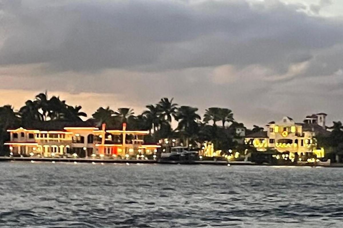 a group of houses on the shore of the water