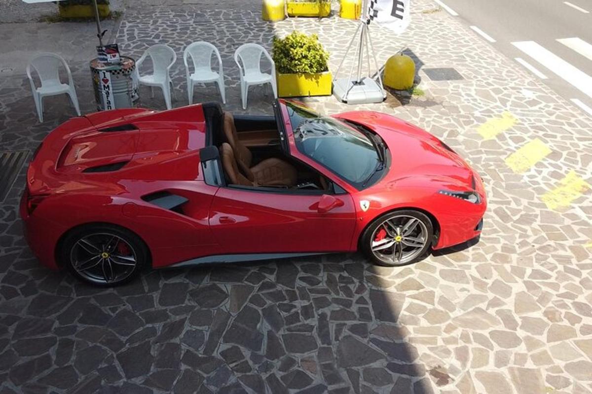 a red car with a dog sitting in the back