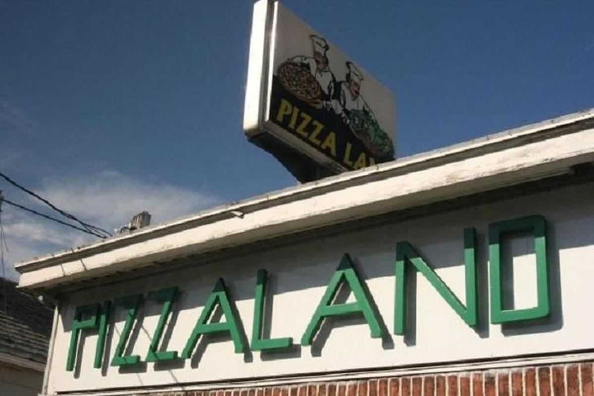 a sign on the top of a hilalani restaurant