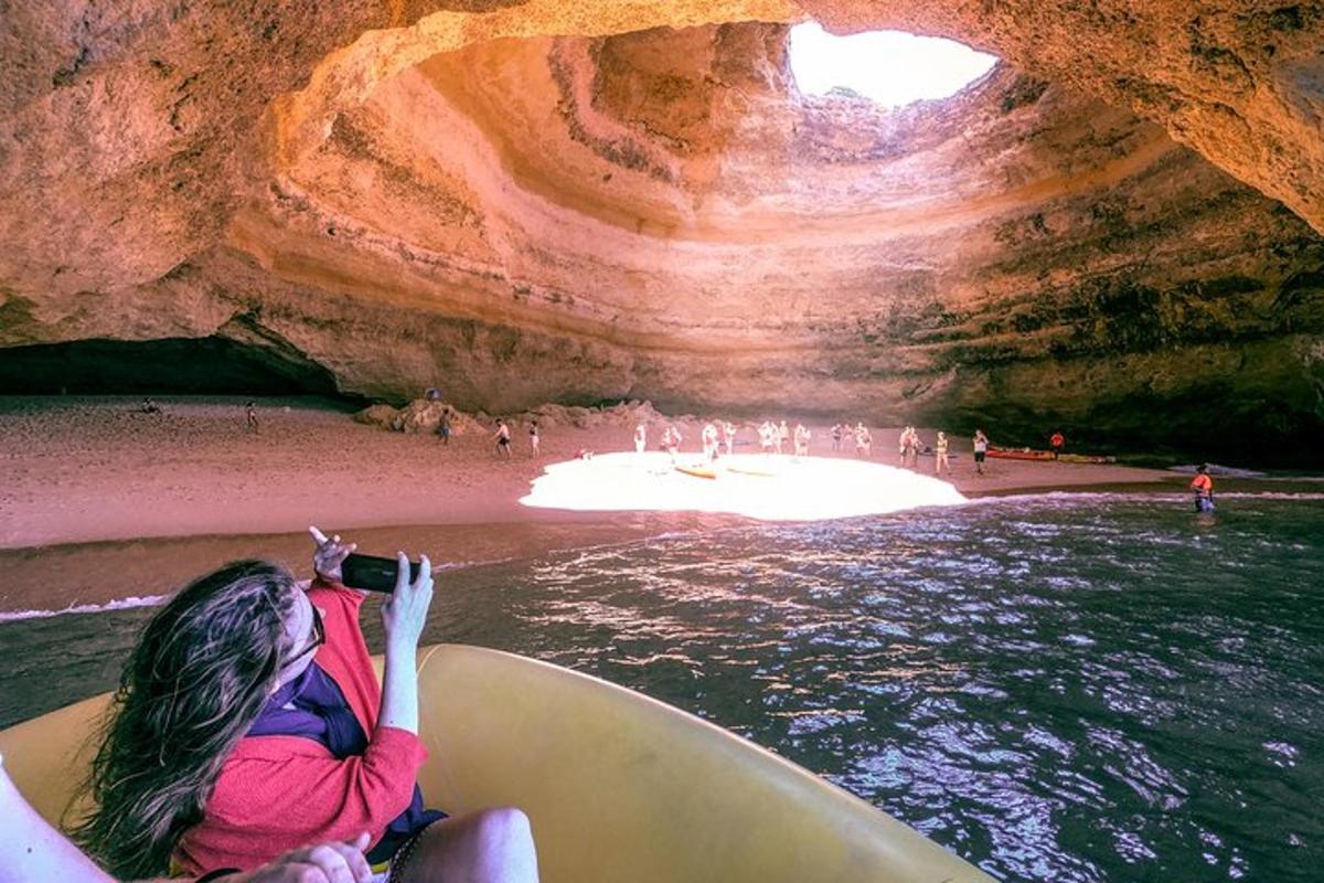 a woman is in a boat in a cave