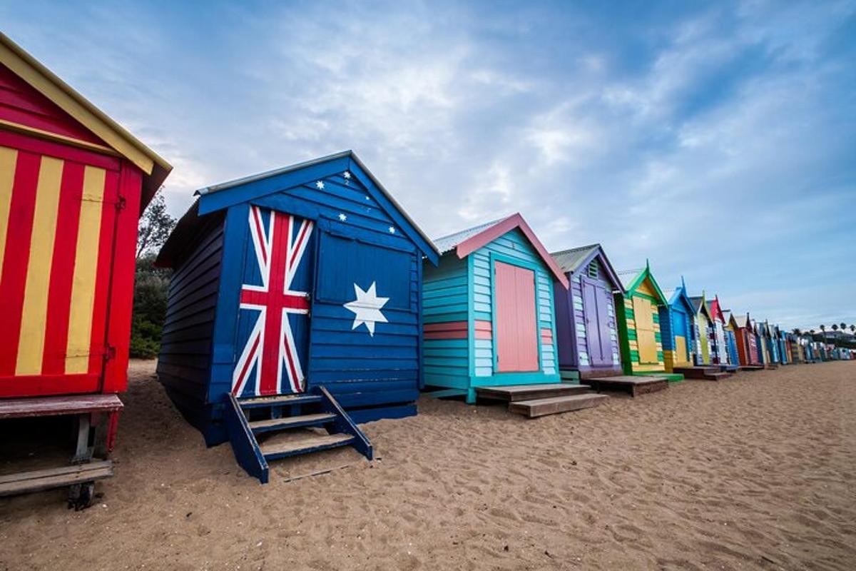 a row of colorful beach huts on a beach