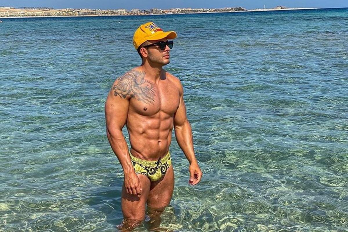 a man standing in the water in the ocean