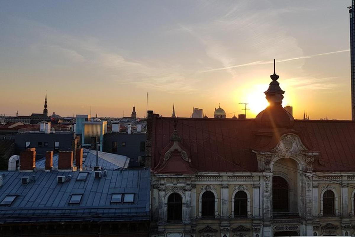an old building with the sunset in the background
