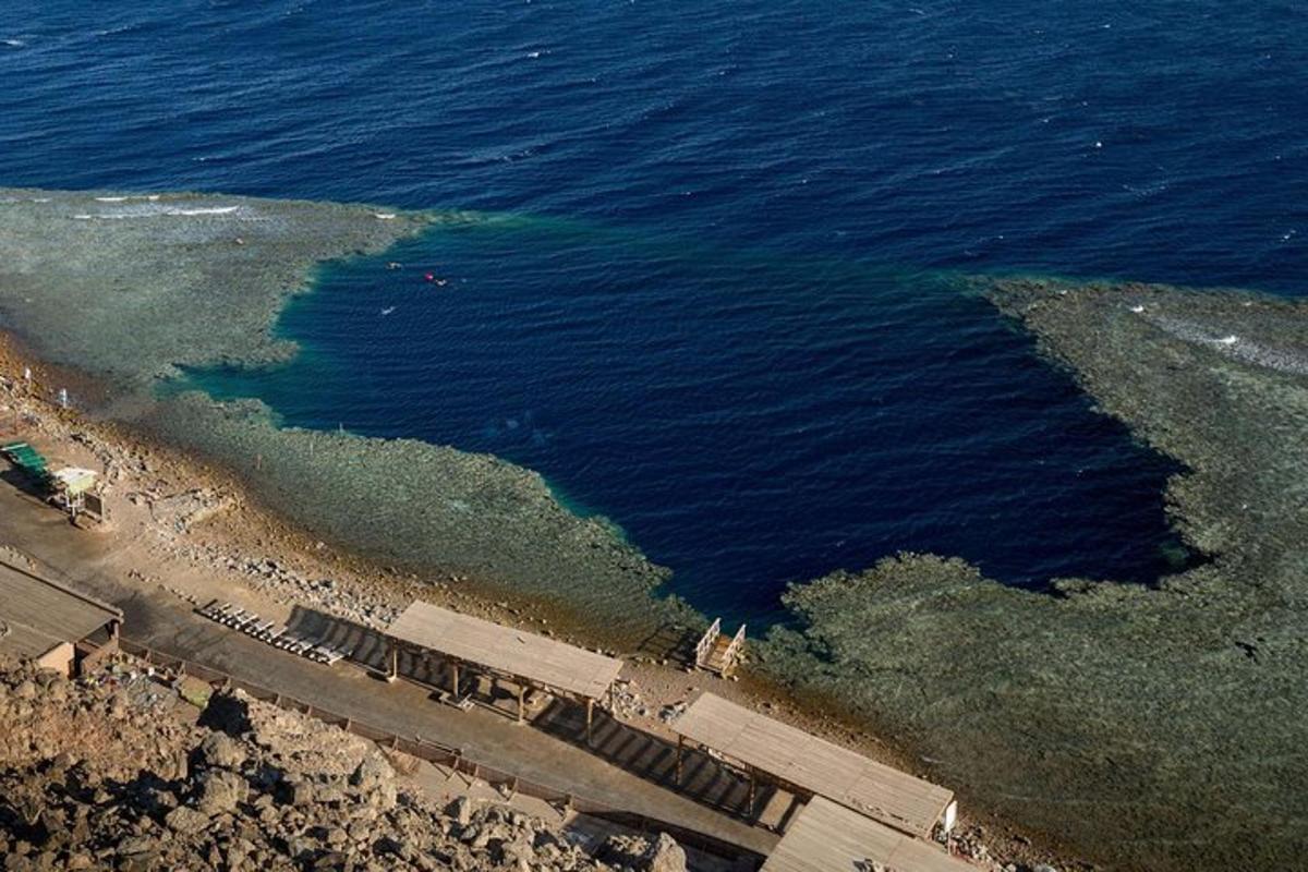 an aerial view of the ocean and a beach