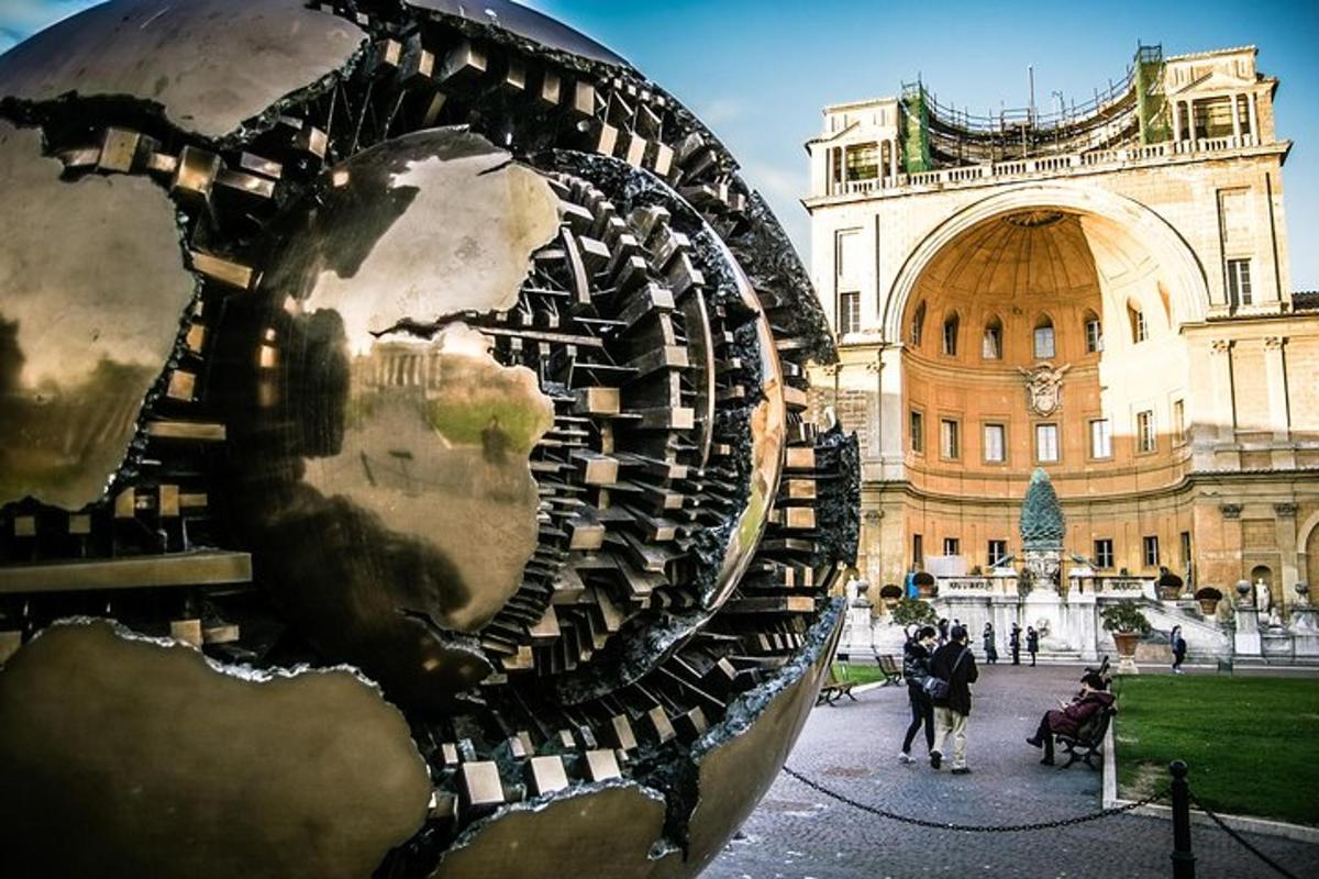 a sculpture of a face in front of a building