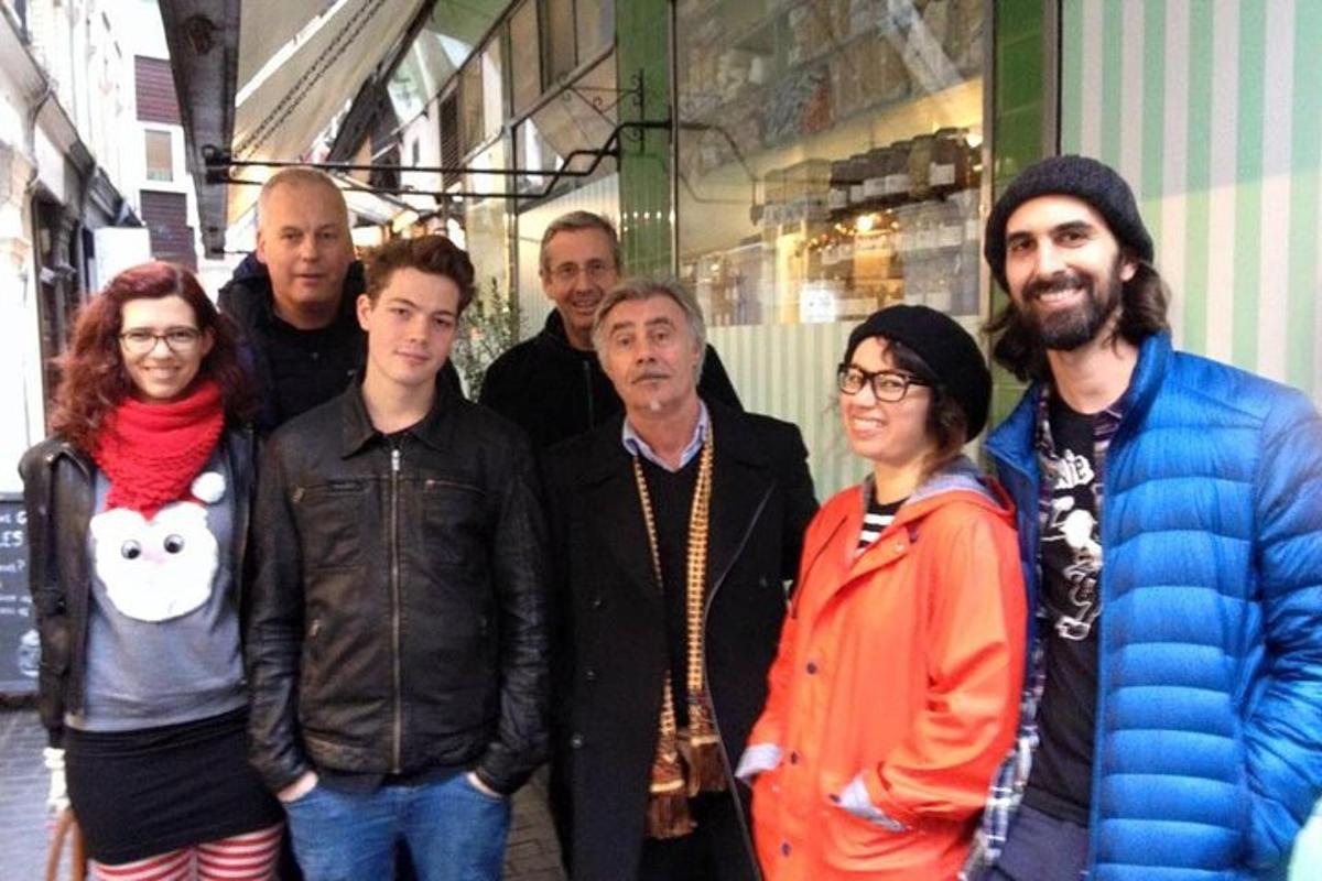 a group of people standing in front of a store