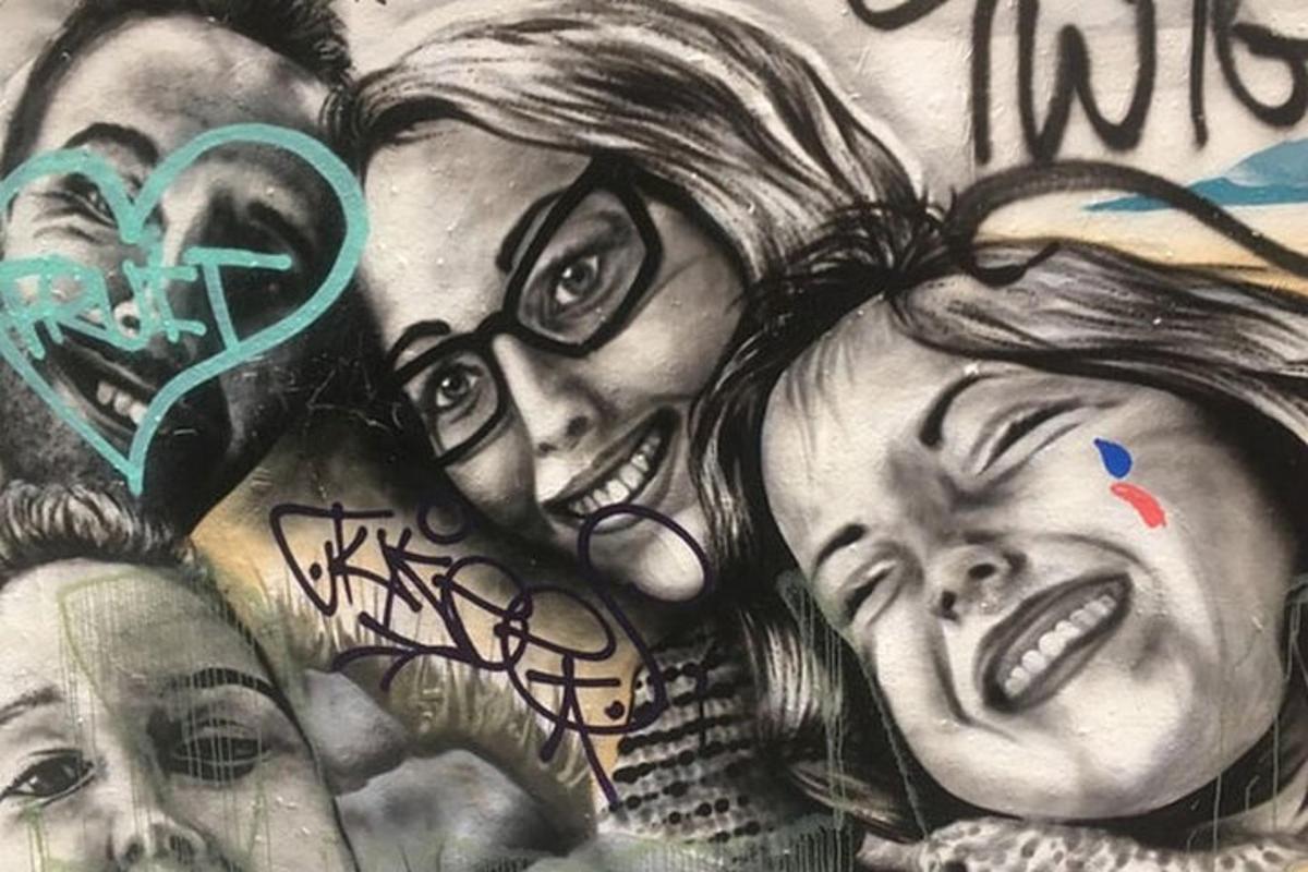 a drawing of a group of people with graffiti