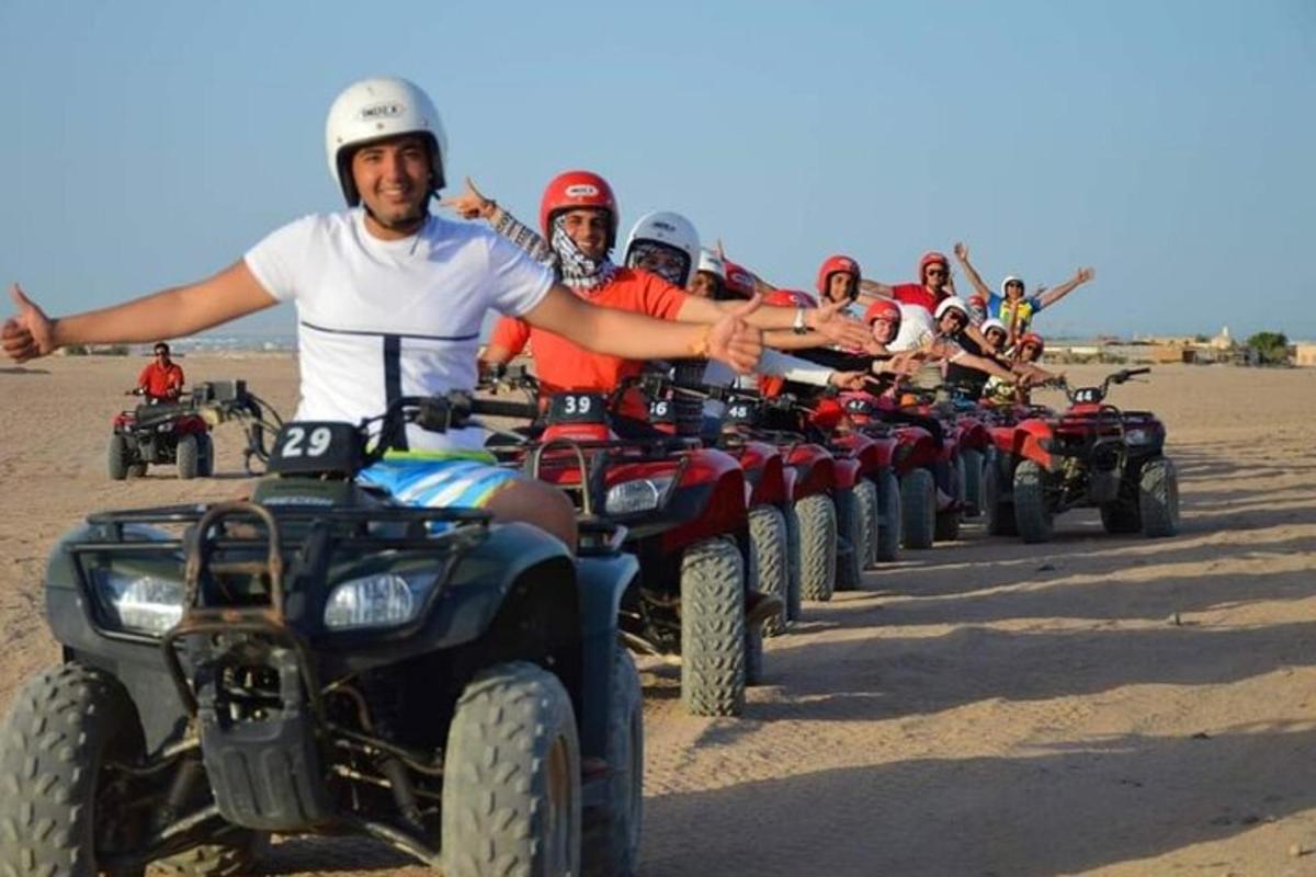 a group of people on atvs in the desert