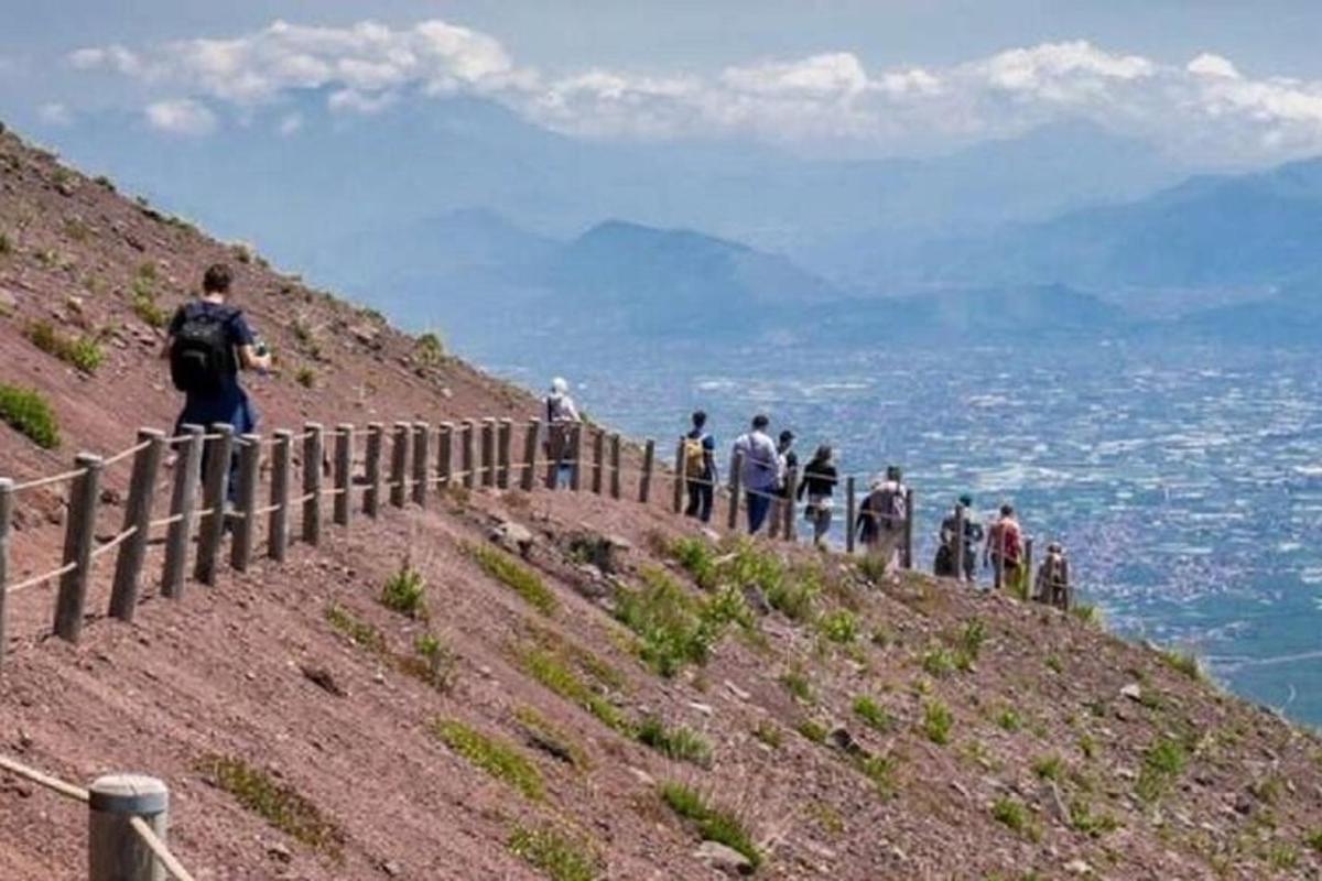 a group of people standing on top of a hill
