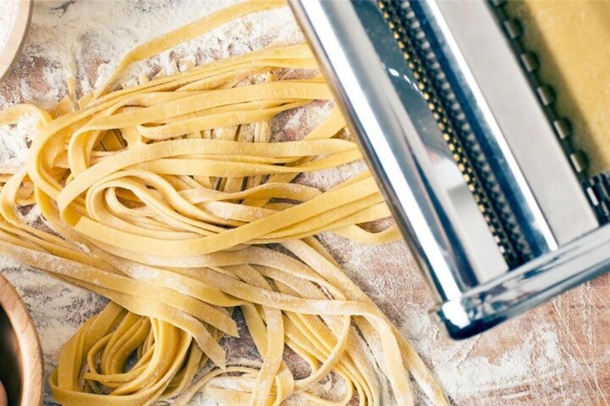 a pile of pasta on a counter next to a pastaractor