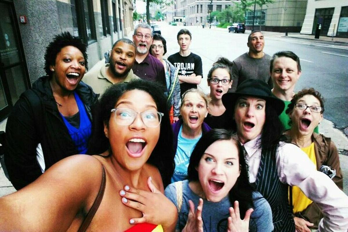 a group of people are posing for a picture