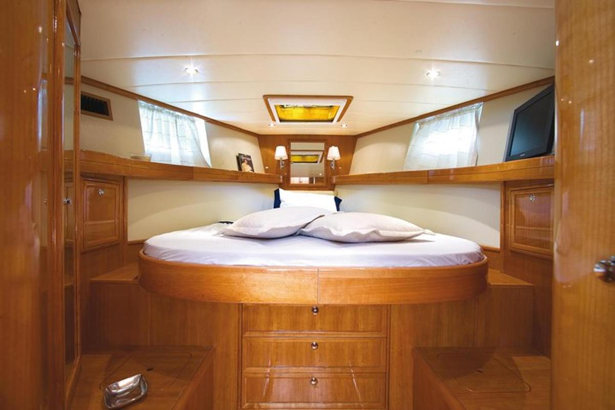 a small bed in the middle of a boat