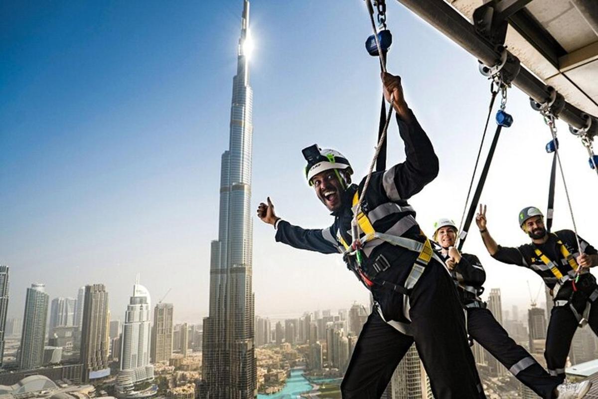 a group of construction workers on the top of a skyscraper