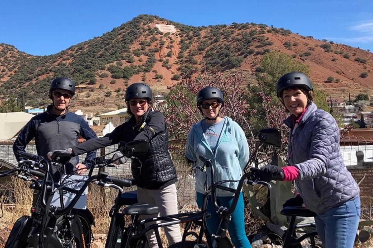 a group of people posing for a picture with their bikes