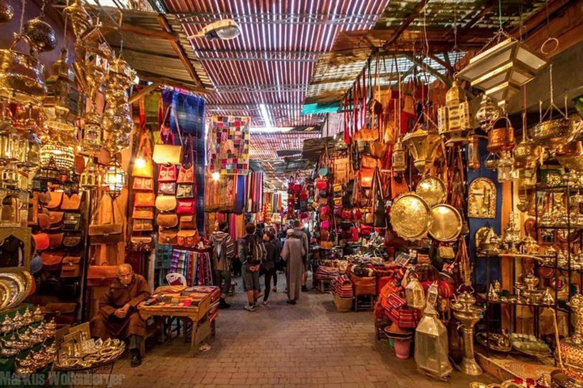 a group of people walking through a shop in a market