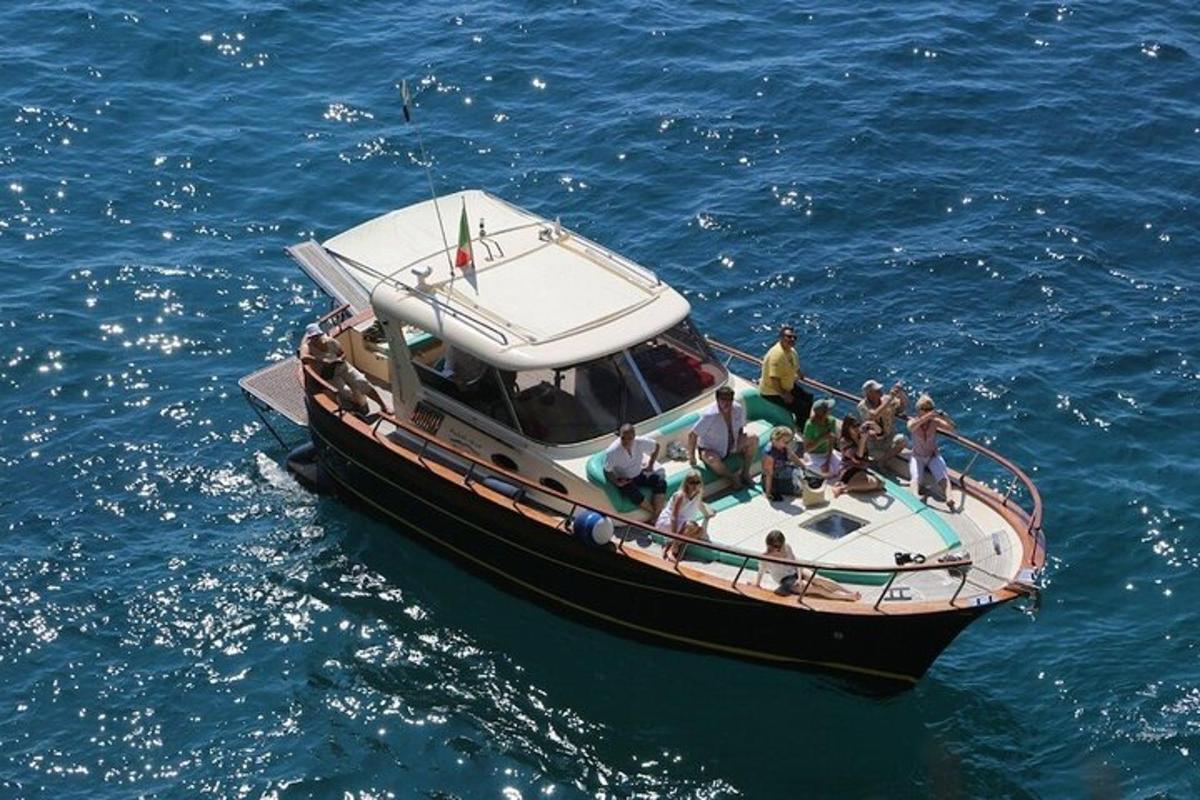 a group of people on a boat in the water