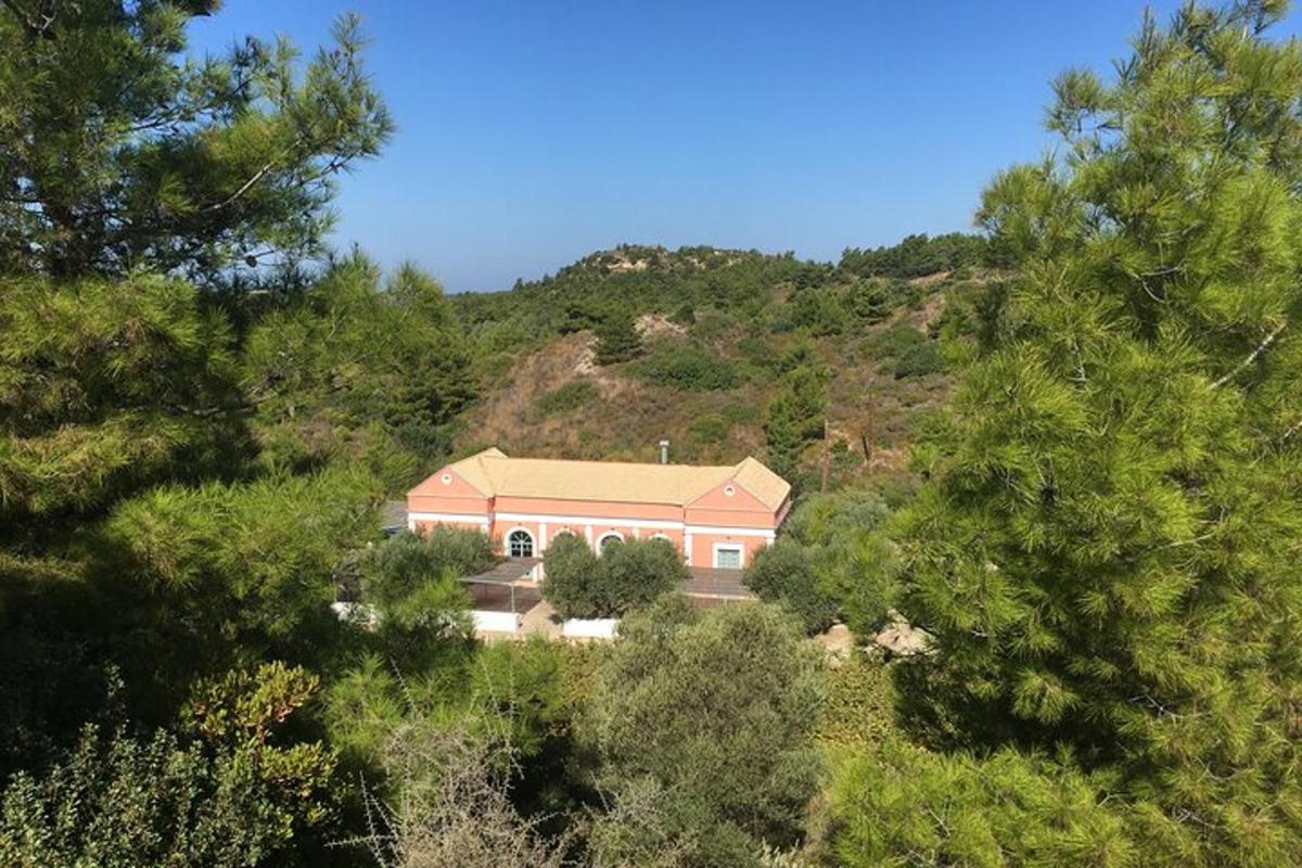 a large house in the middle of a mountain