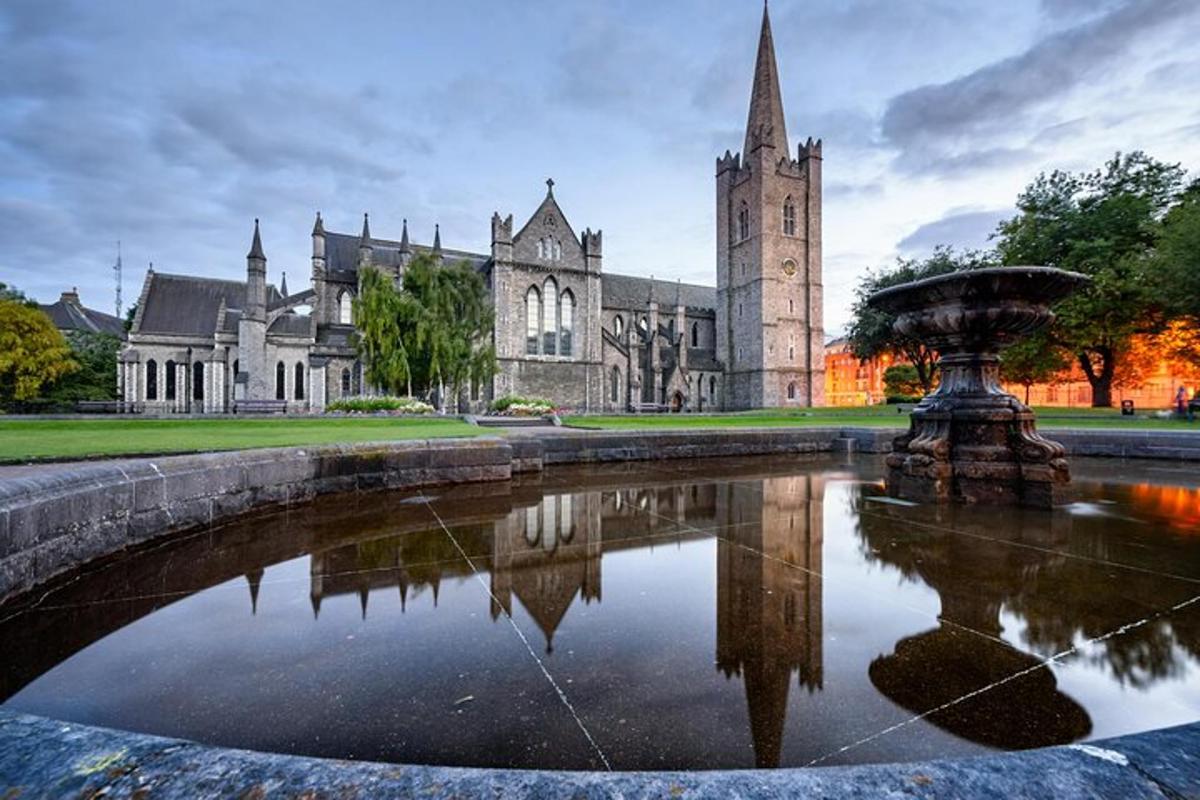 a building with a fountain in front of a church