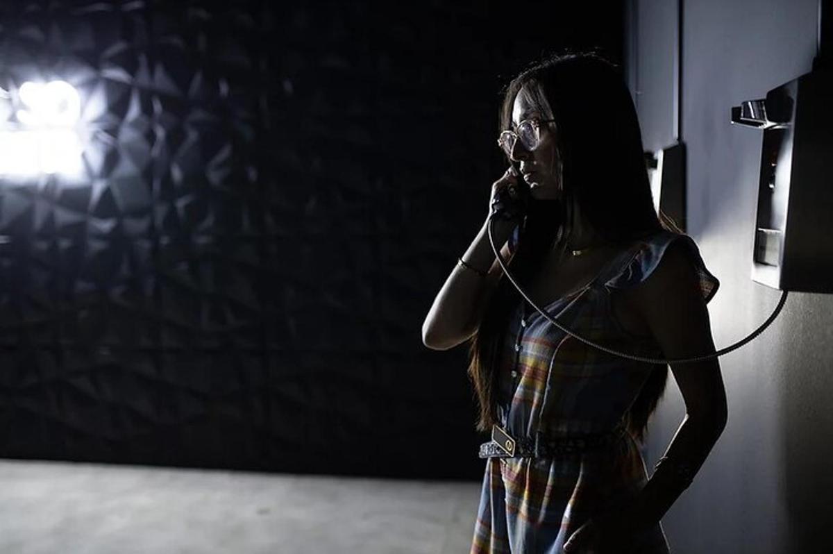 a woman is talking on a cell phone