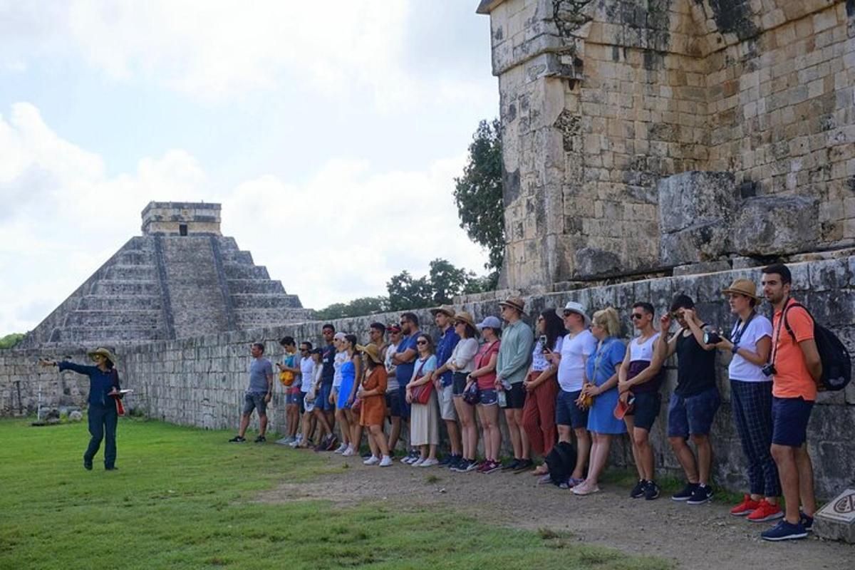 a group of people standing in front of a wall