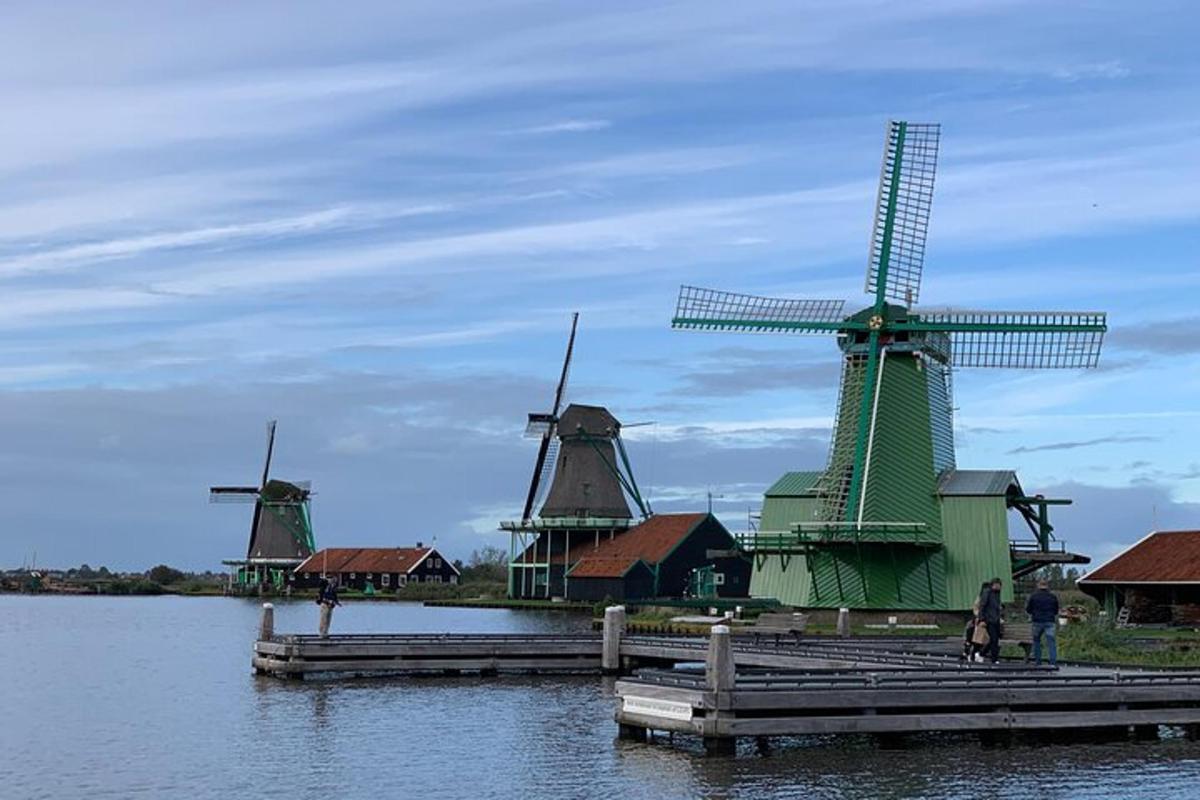 a group of windmills sitting in the water