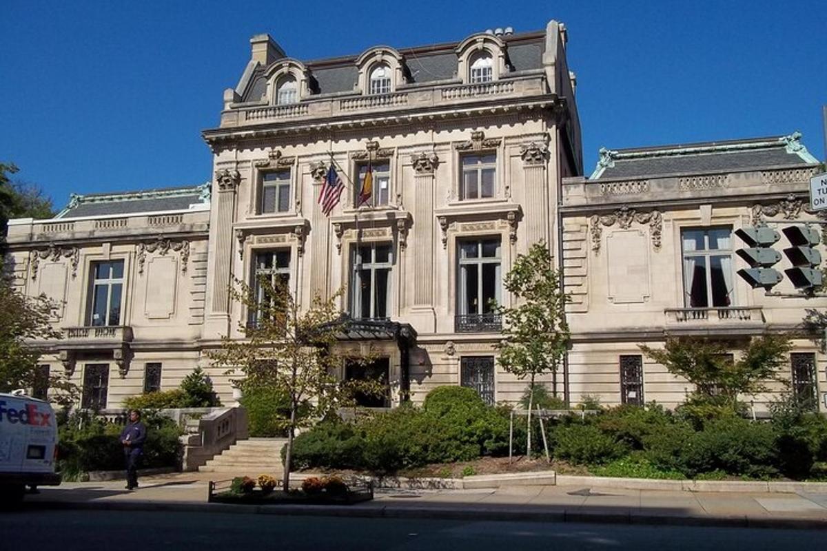a large white building with an american flag on it