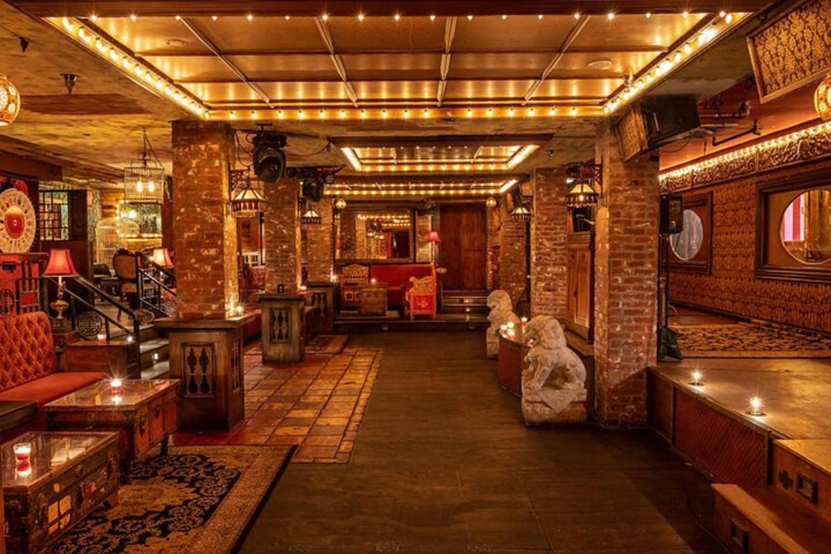 a large room with brick walls and a bar