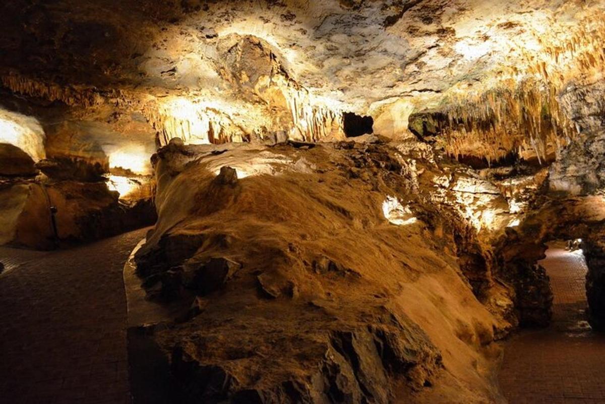 a cave with a large rock in it