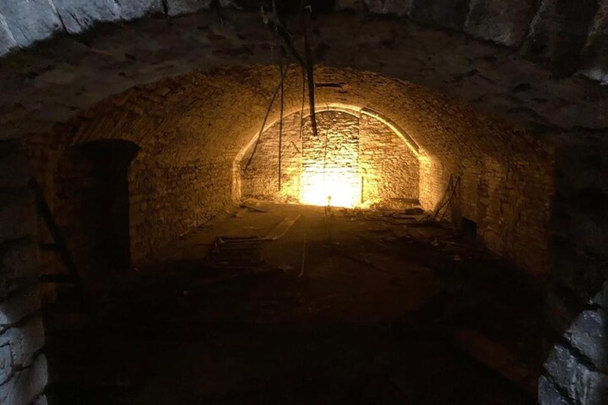 a dark tunnel with a light at the end of it