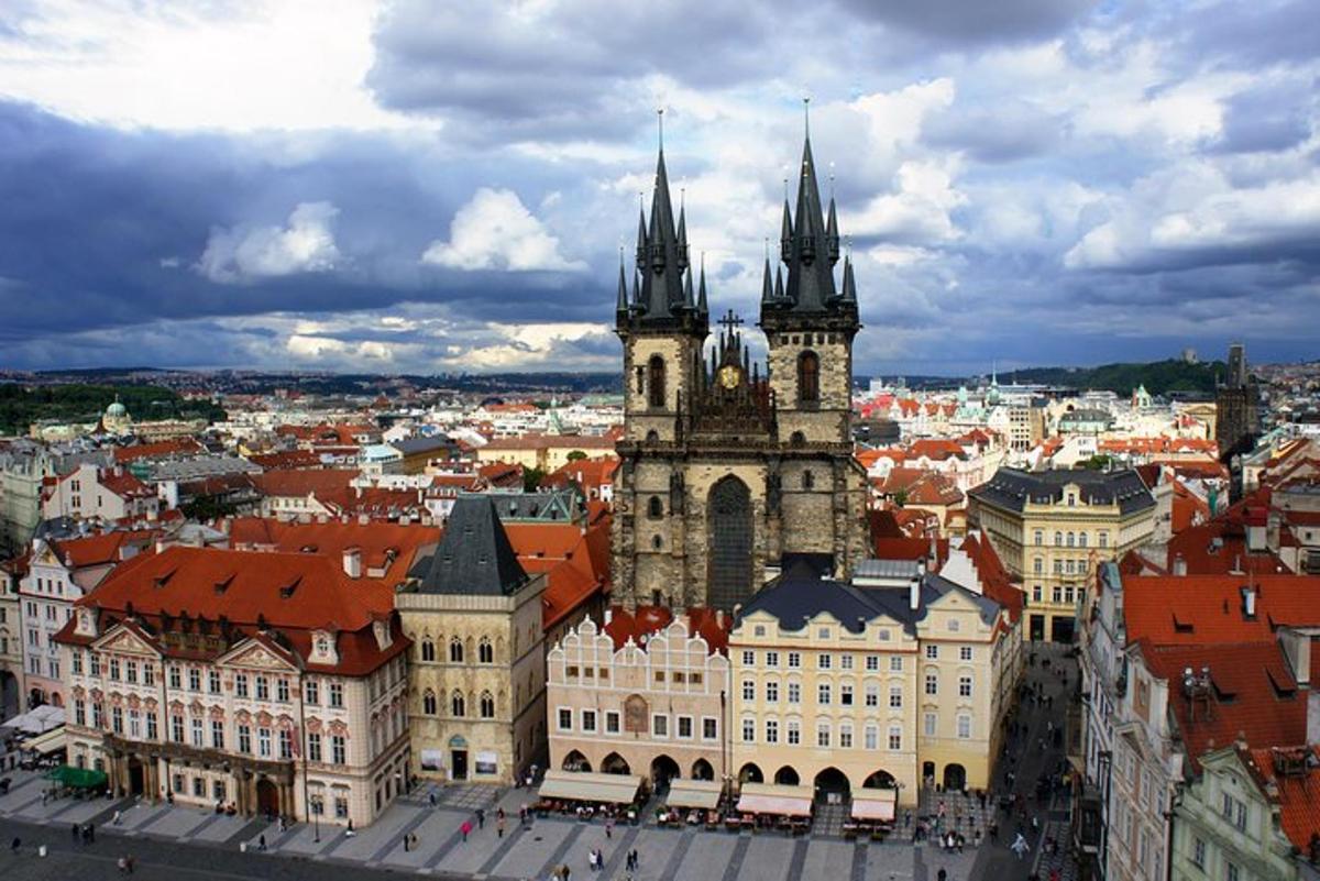 a large building with a clock tower in a city