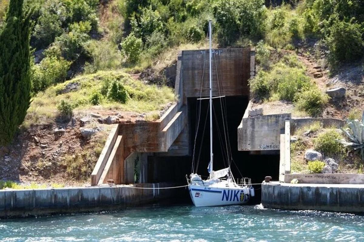 a boat is docked in a tunnel in the water