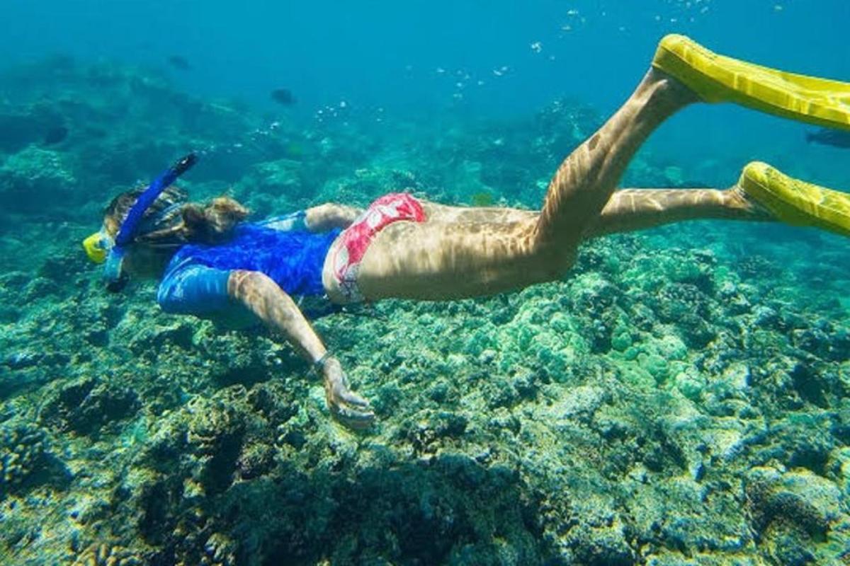 a man is swimming in the water in the ocean