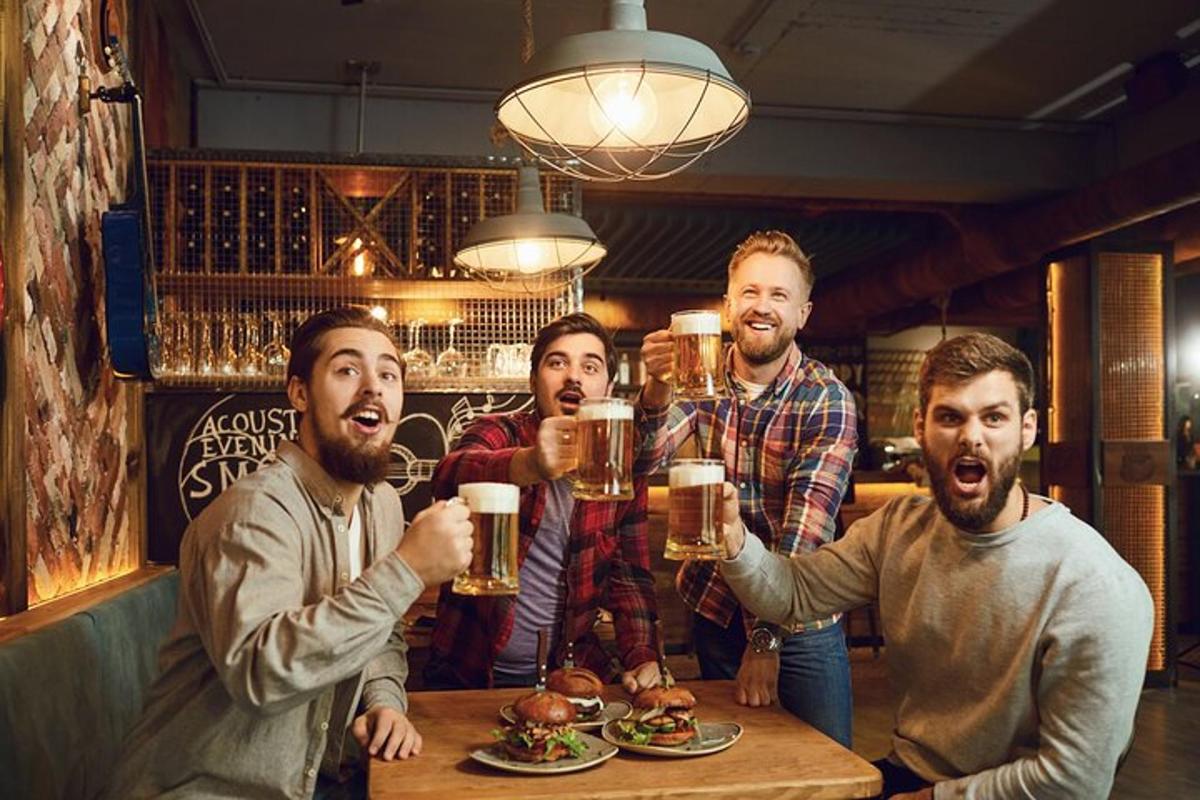 a group of men drinking beer at a bar