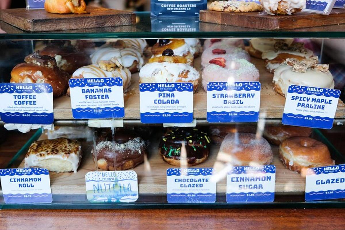 a display of different types of donuts in a bakery