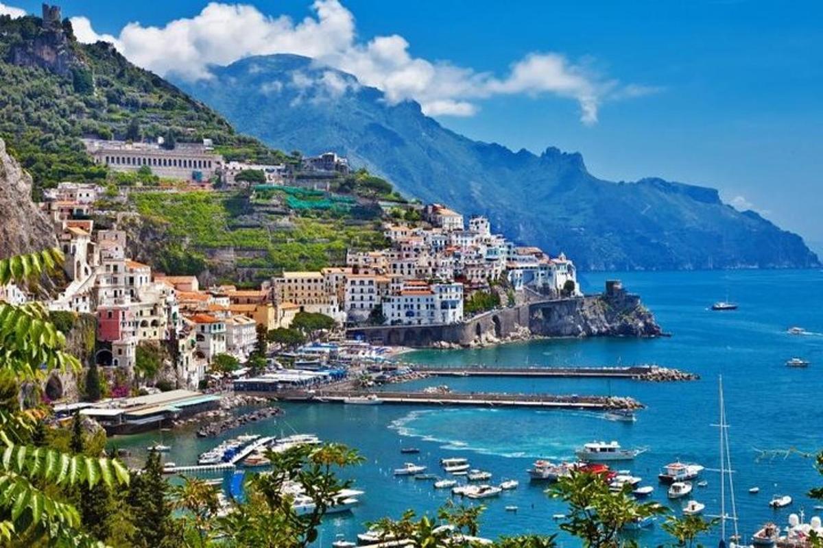 a view of the amalfi coast with boats in the water