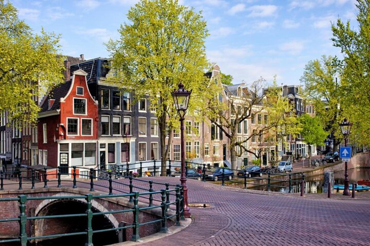 a bridge over a canal in a city with buildings
