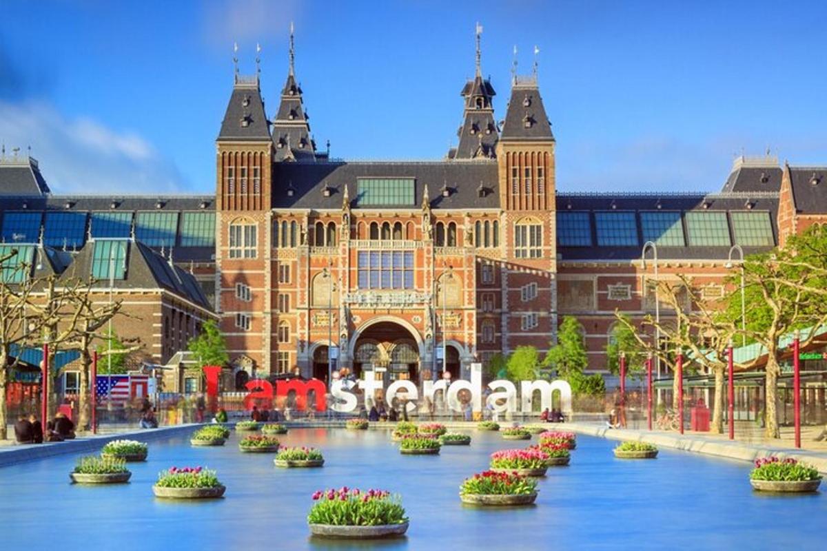 a large building with flowers in front of it