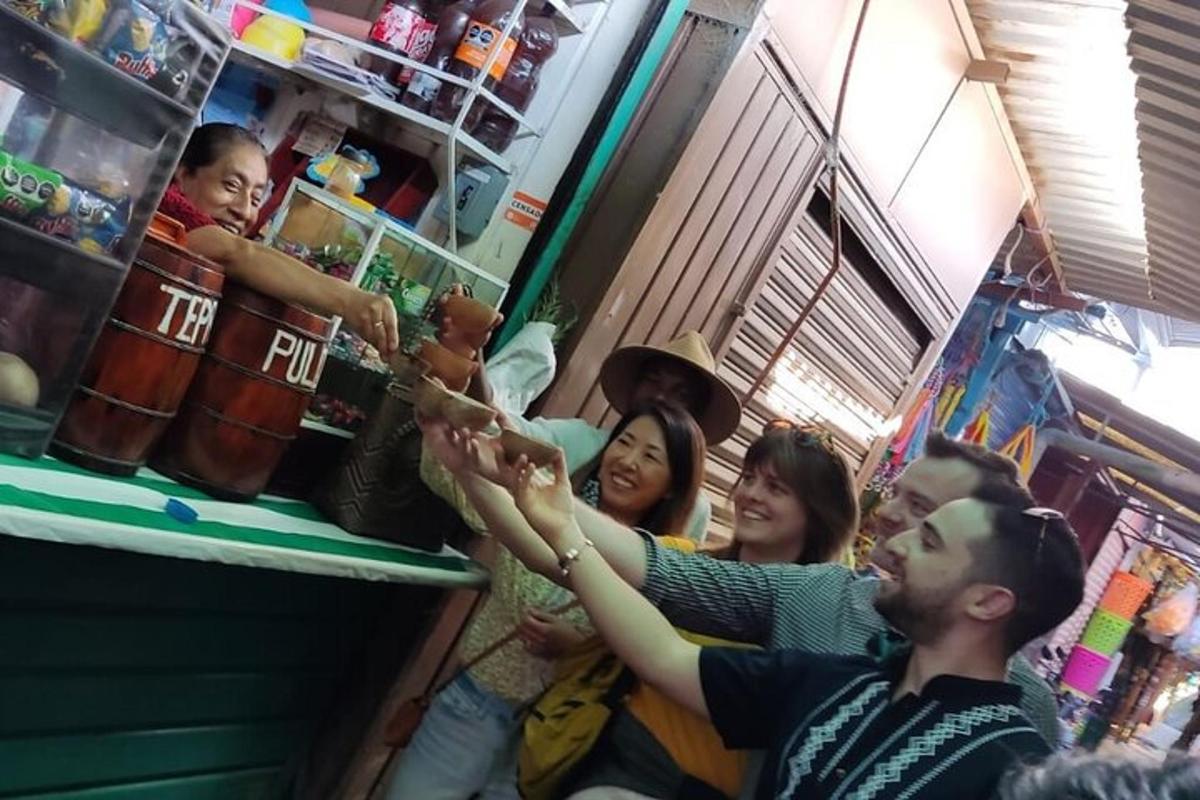 a group of people clapping in front of a bar