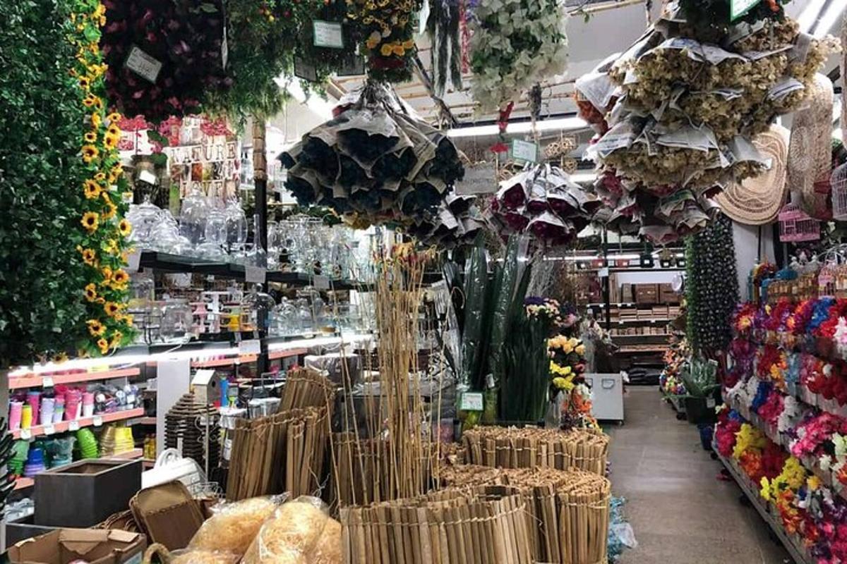 a store filled with lots of flowers and other items