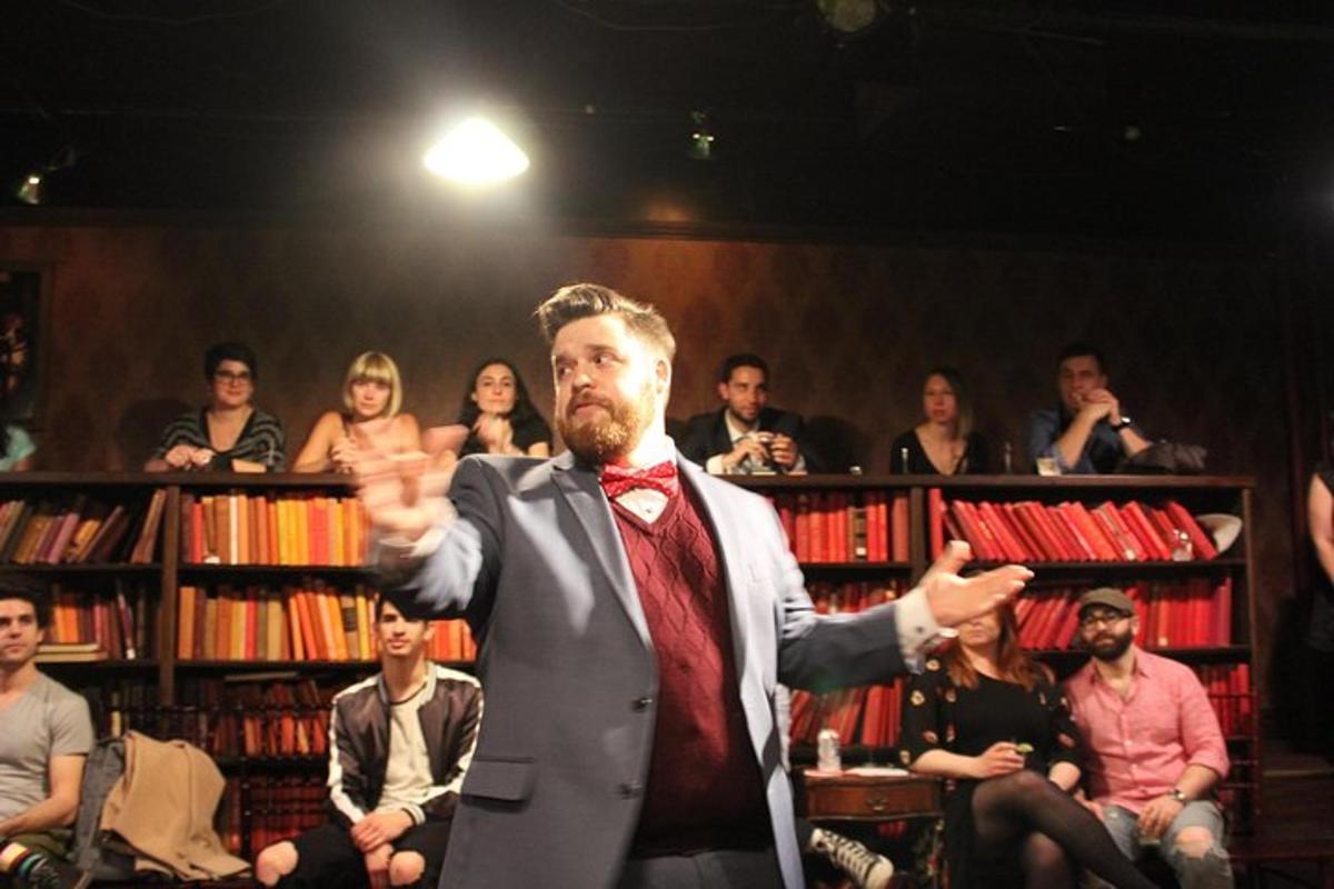 a man in a suit standing in front of a crowd