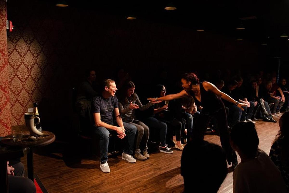 a group of people watching a woman in front of a crowd