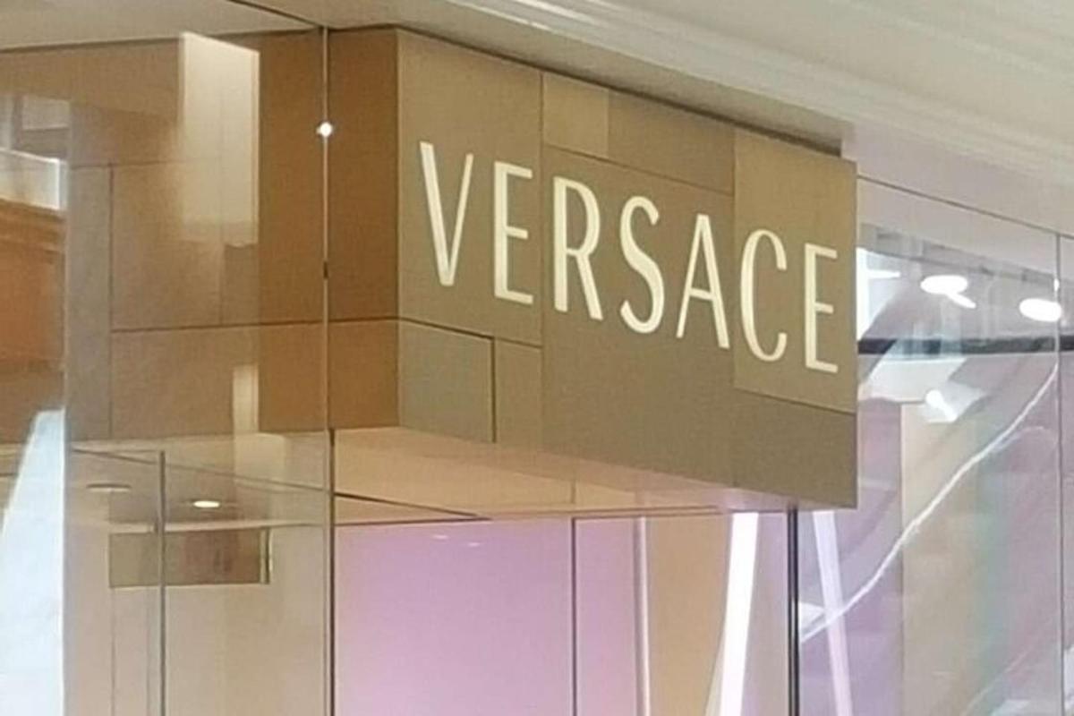 a versace sign on the side of a store window