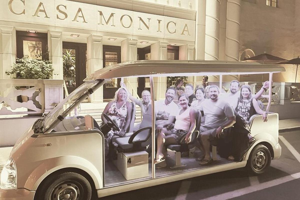 a group of people sitting in a golf cart
