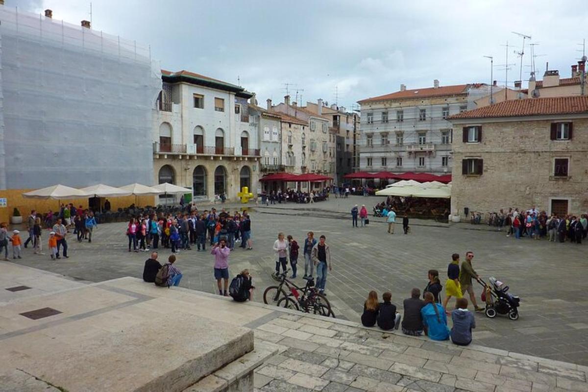 a group of people standing around in a courtyard