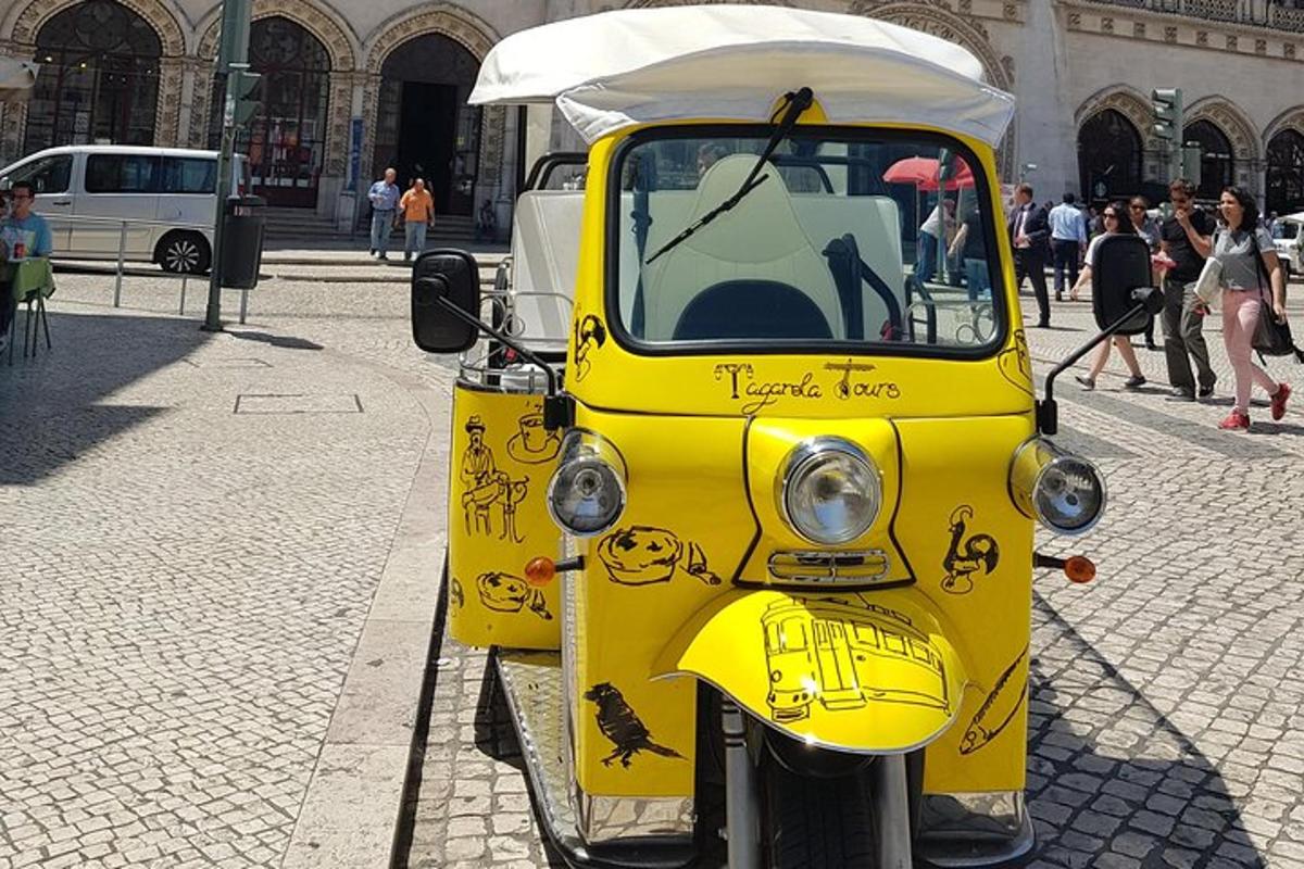 a yellow vehicle with writing on it on a street