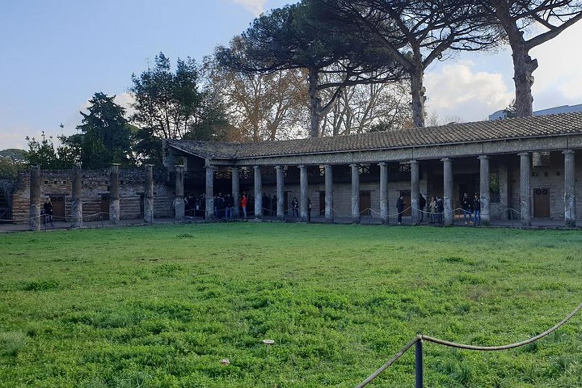a building with a large field in front of it